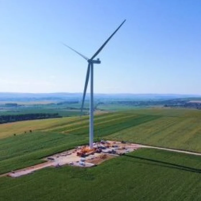 Wind turbine in an open field