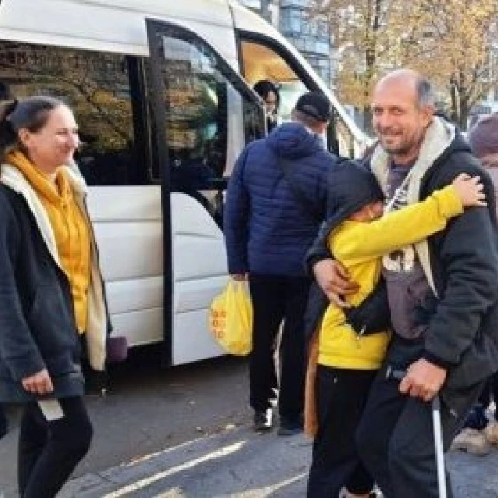 Family reunion near a bus