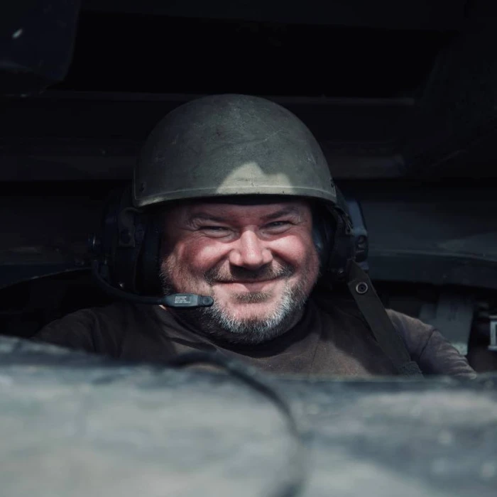 Armored vehicle crew member wearing a helmet