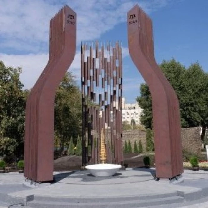 Memorial with an eternal flame and steel sculptures