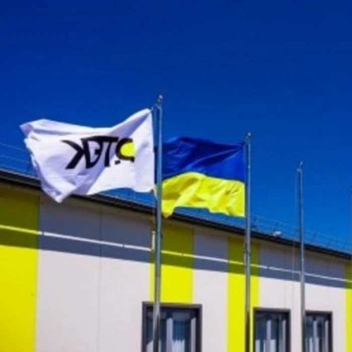 Ukrainian and DTEK flags flying side by side