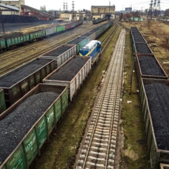 Freight trains loaded with coal at a rail yard