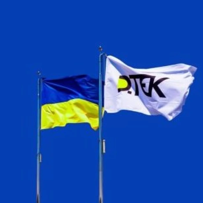 Ukrainian and DTEK flags flying side by side