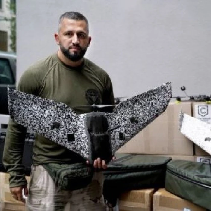 Man holding a military reconnaissance drone