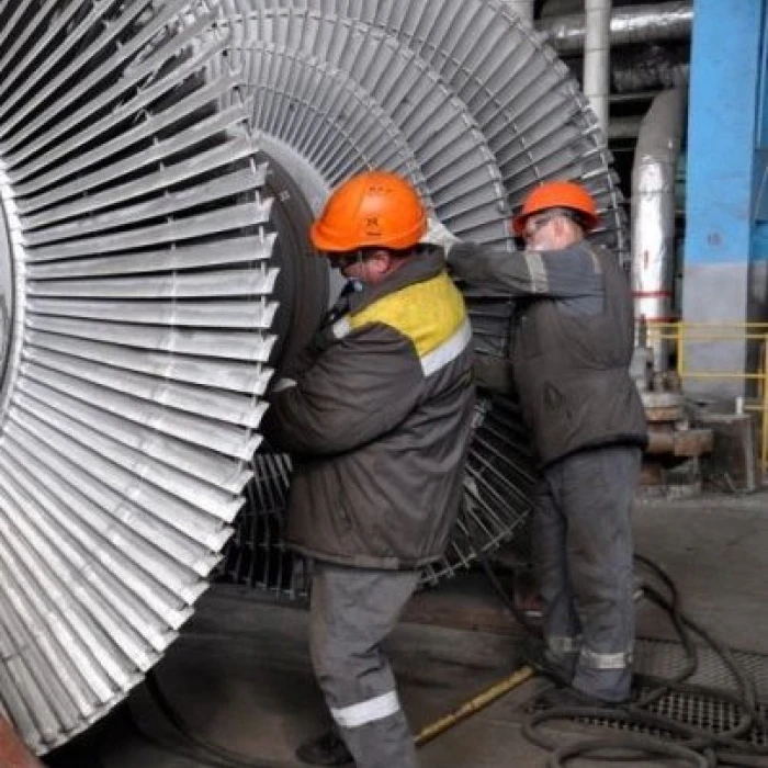 Workers servicing industrial turbine