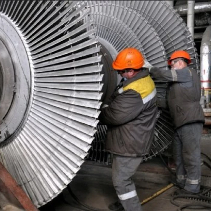 Workers servicing industrial turbine
