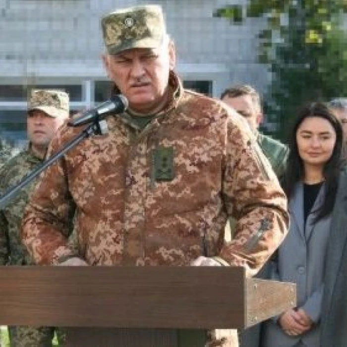 Military officer speaking at a podium