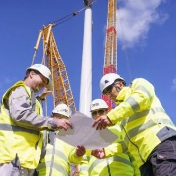 Engineers reviewing construction plans